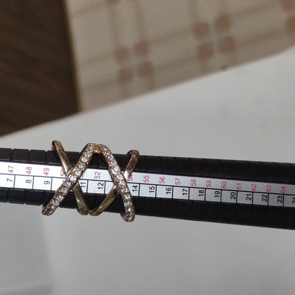 Jewelry - Gold tone infinity band with rhinestone chips